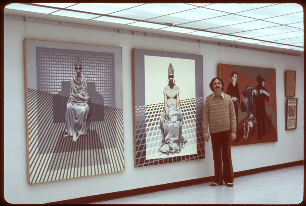 David Edward Byrd with paintings in an exhibition